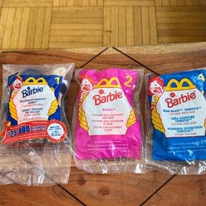 Vintage Barbie Happy Meal Toy Set with Pink, Red, and Blue Packaging